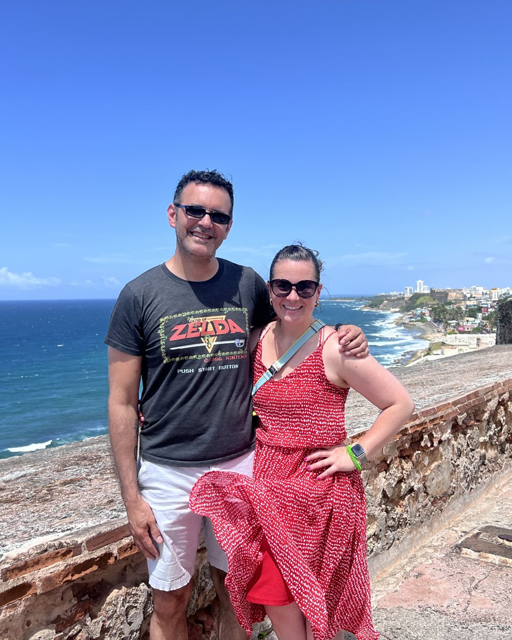 Jake and Salena on the old fort walls above the sea in Puerto Rico